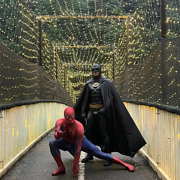 batman and spiderman on lights bridge