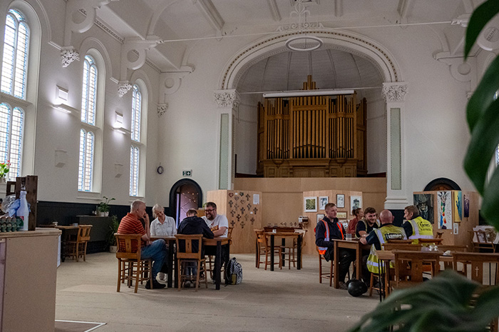 View of the newly repainted Trinity Hall, looking towards the organ with coffee tables in front