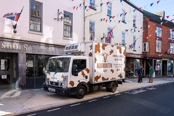 Milk lorry parked for a delivery in the layby outside Costa St John Street