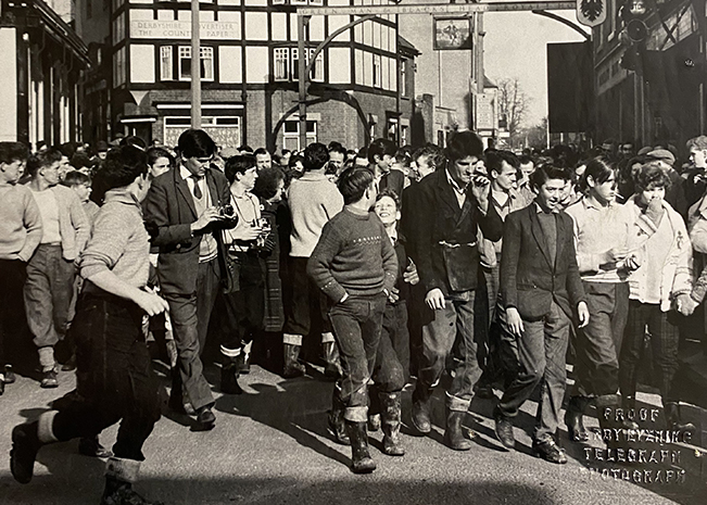 Black and white photo from the 1960s showing Shrovetide crowd on St John Street